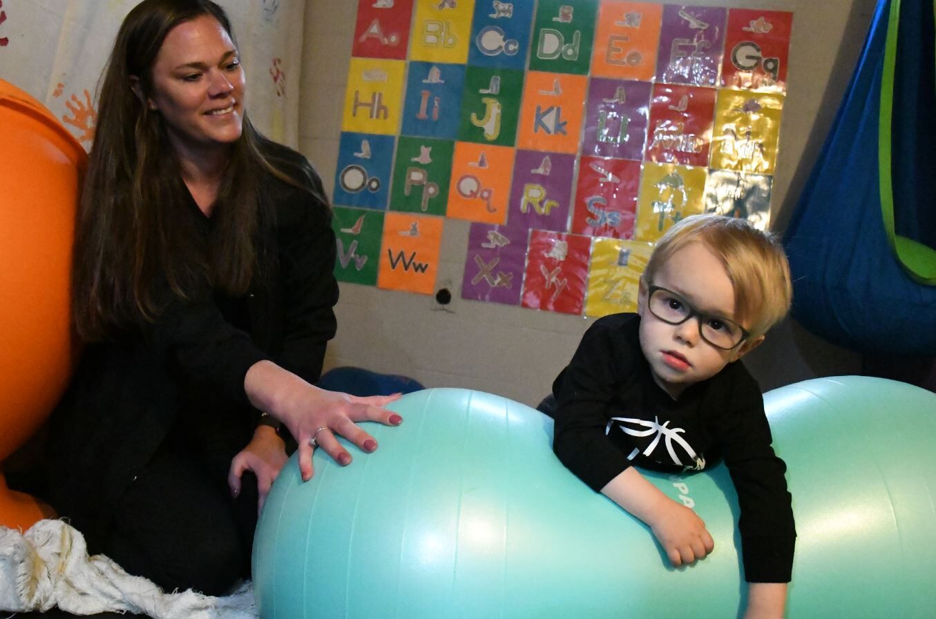 Daxton DeGroot uses his therapy ball
